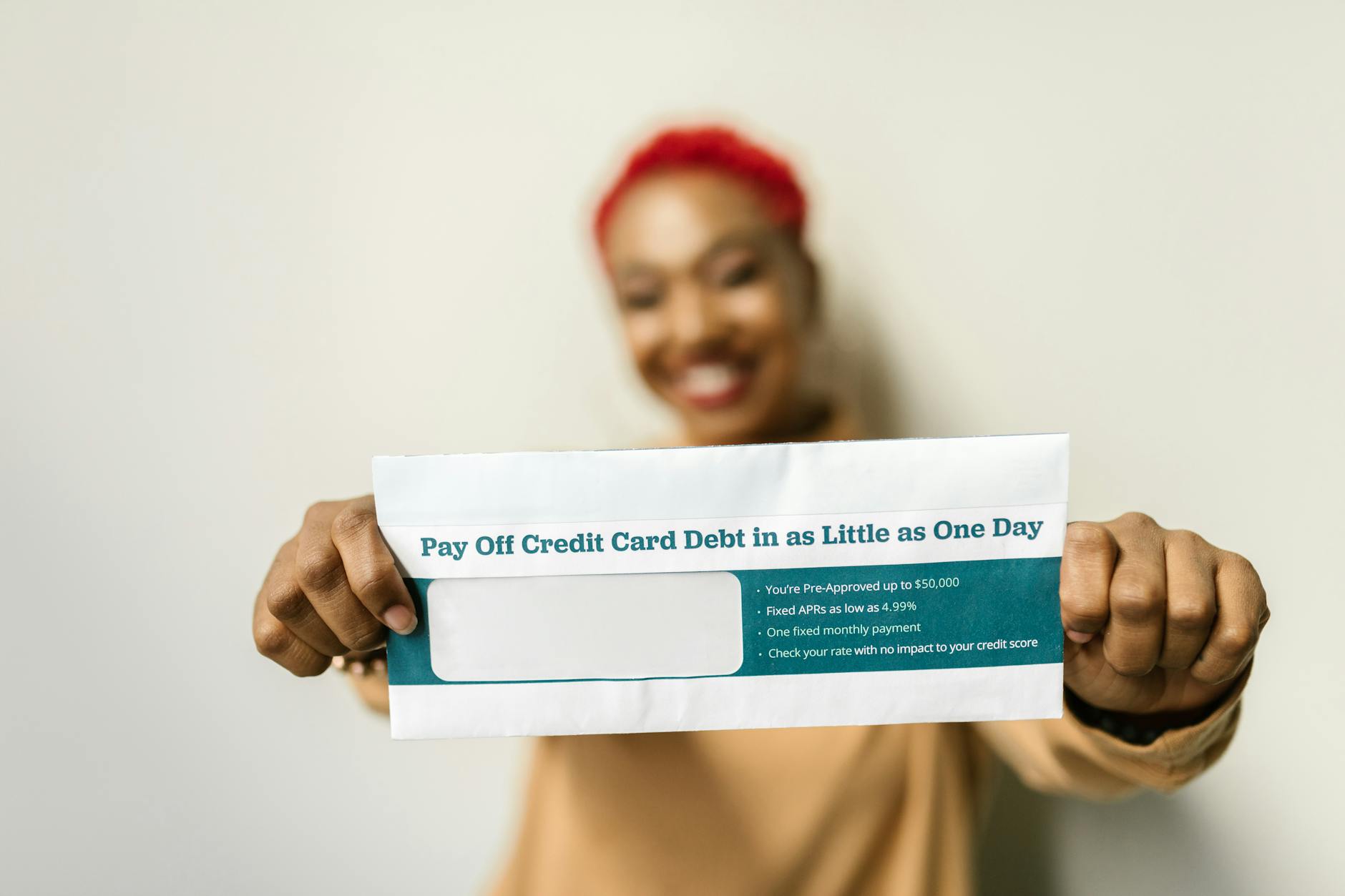 a woman holding an envelope